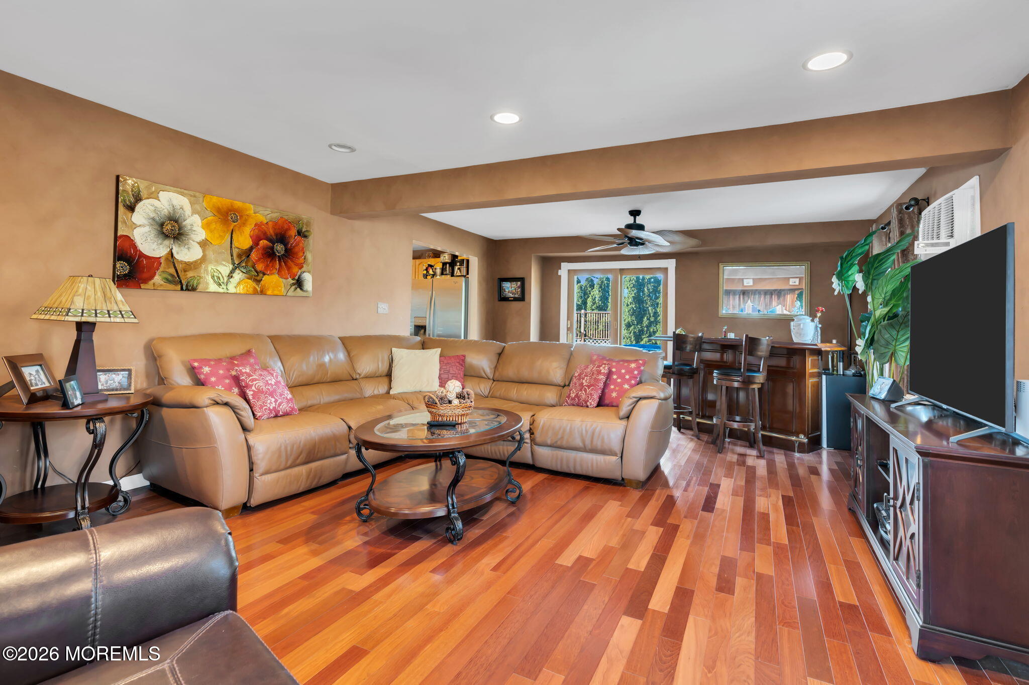 83 Seawood Drive Keyport, NJ 07735 - Photo 9 of 23 a living room with furniture flat screen tv and wooden floor