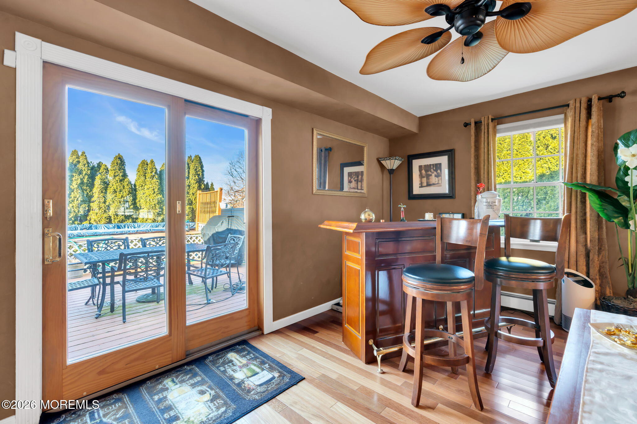 83 Seawood Drive Keyport, NJ 07735 - Photo 10 of 23 a view of a dining room with furniture a chandelier and wooden floor