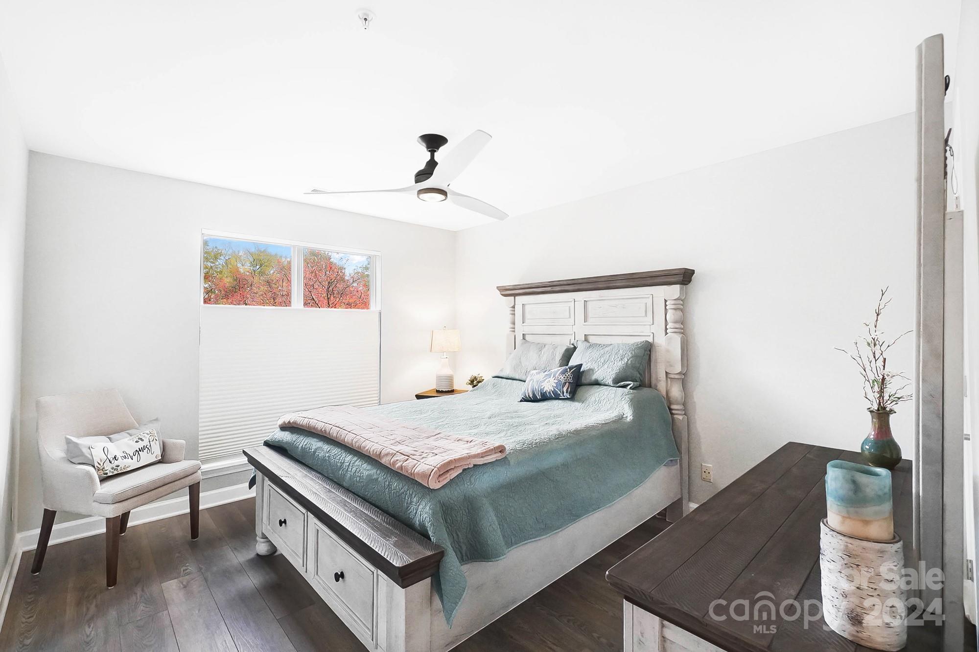 18621 Harborside Drive Cornelius, NC 28031 - Photo 17 of 33 a bedroom with a bed and wooden floor