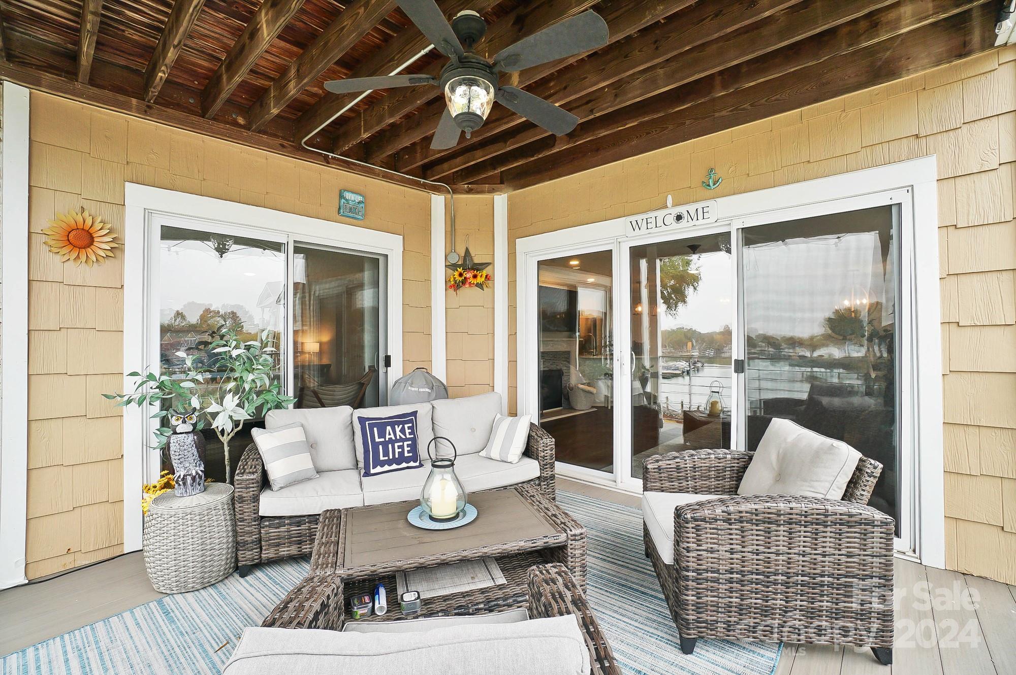 18621 Harborside Drive Cornelius, NC 28031 - Photo 2 of 33 a living room with furniture and a large window