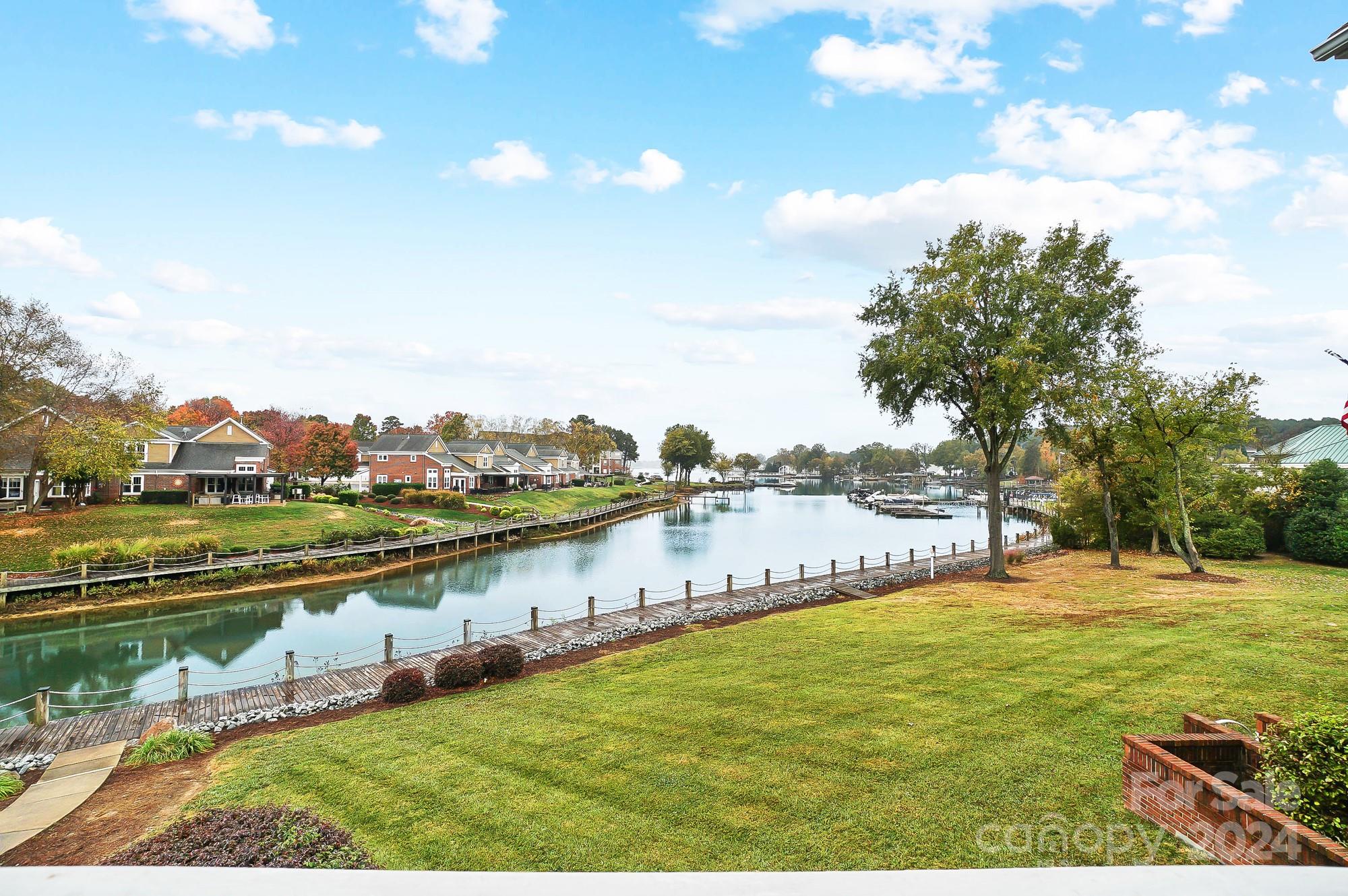 18621 Harborside Drive Cornelius, NC 28031 - Photo 29 of 33 a view of a lake with houses in the back