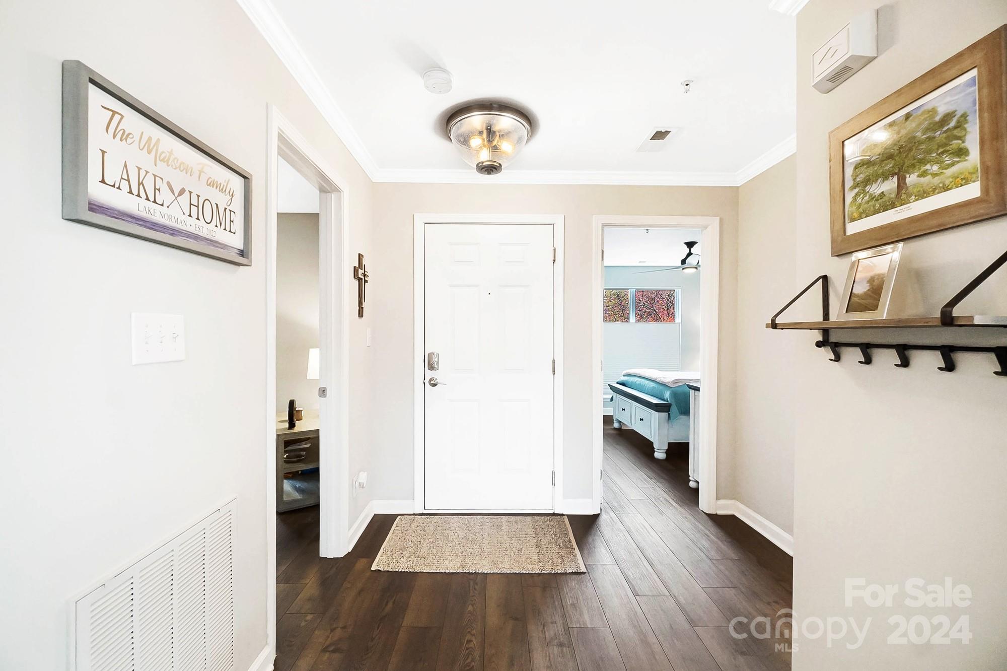 18621 Harborside Drive Cornelius, NC 28031 - Photo 3 of 33 a view of hallway with livingroom and wooden floor