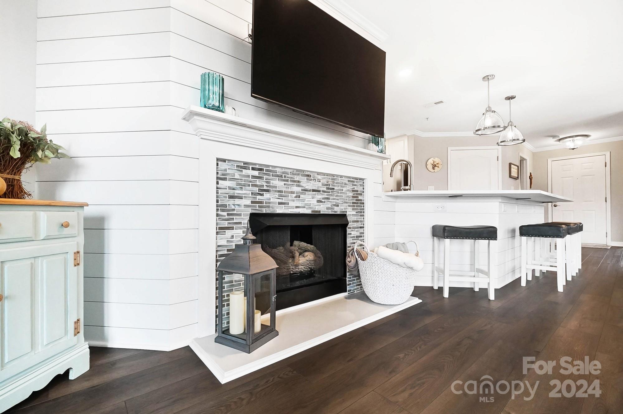 18621 Harborside Drive Cornelius, NC 28031 - Photo 5 of 33 a living room with furniture and a fireplace