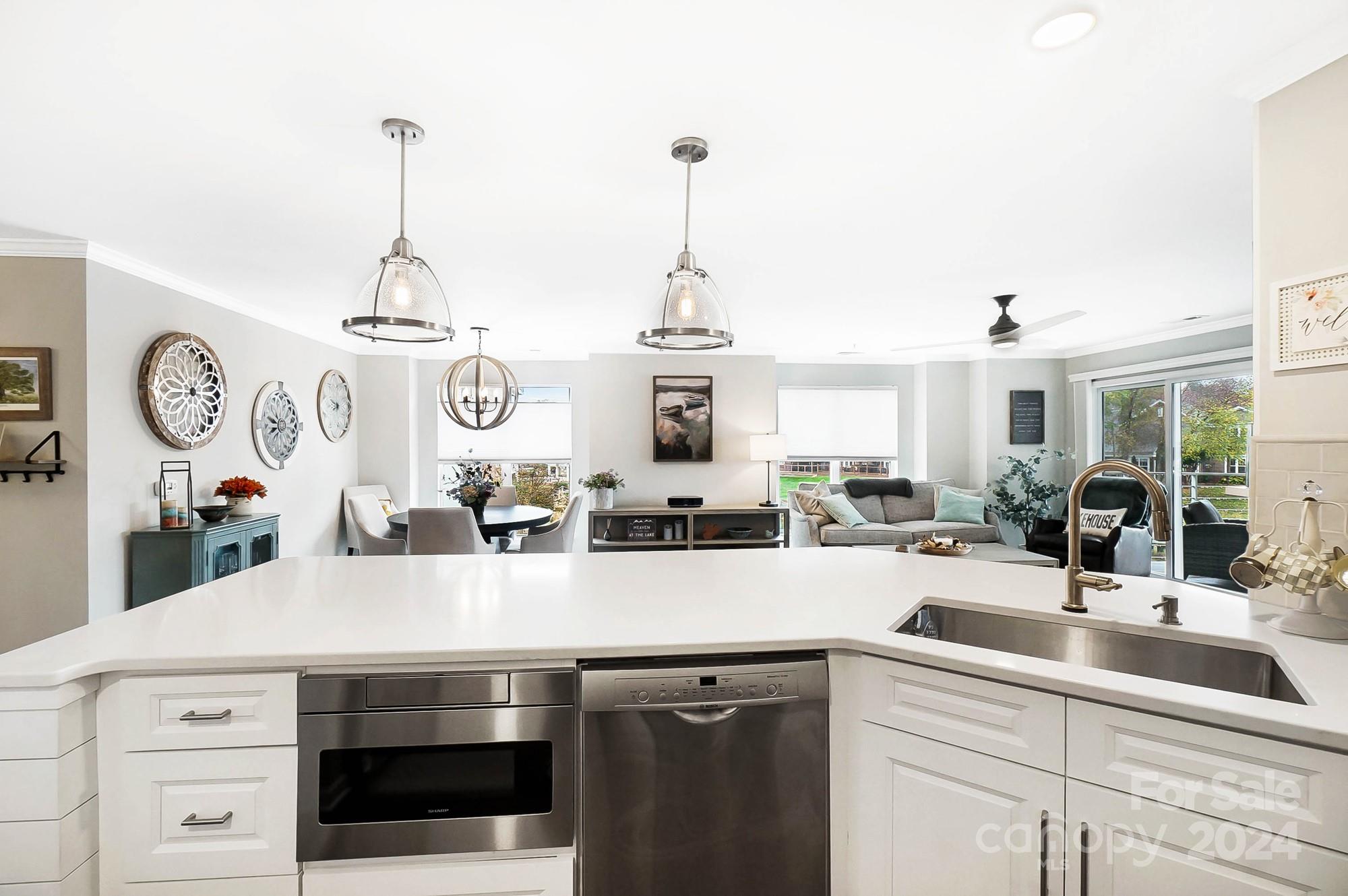 18621 Harborside Drive Cornelius, NC 28031 - Photo 8 of 33 a kitchen with a sink and a clock on the wall