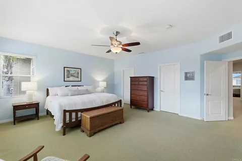 a bathroom with a tub a toilet and a shower