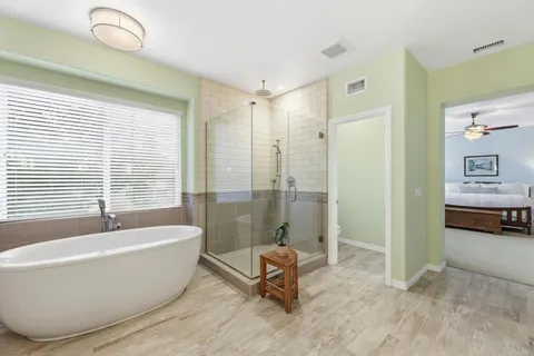 a bedroom with a large bed and a window