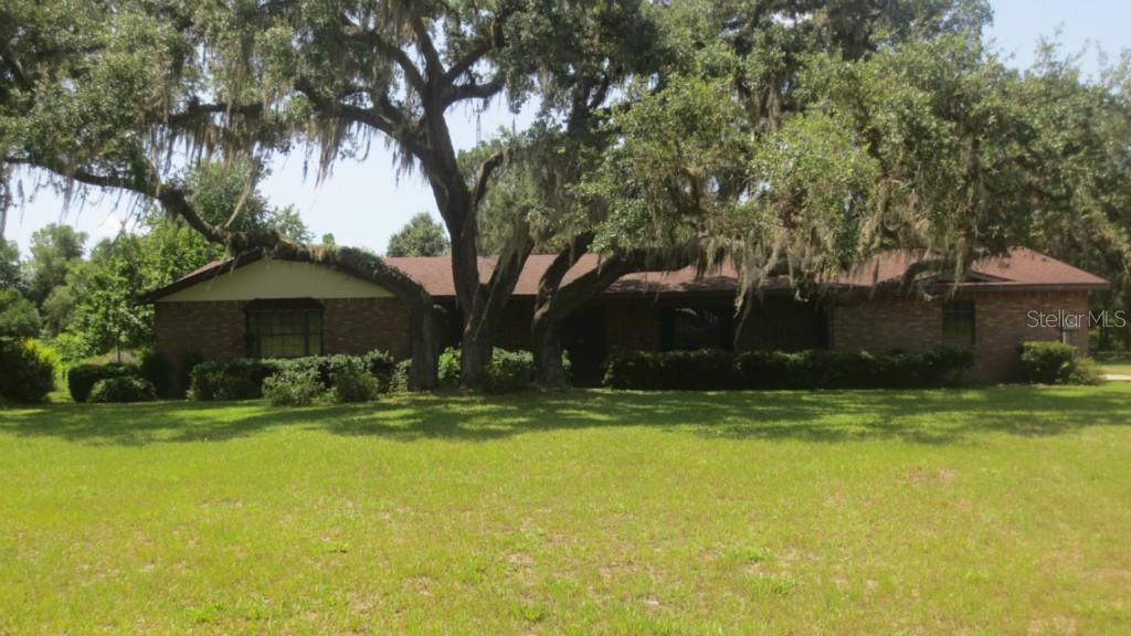 341 Little Brown Church Road Pierson, FL 32180 - Photo 1 of 1 a view of a house with swimming pool and a yard