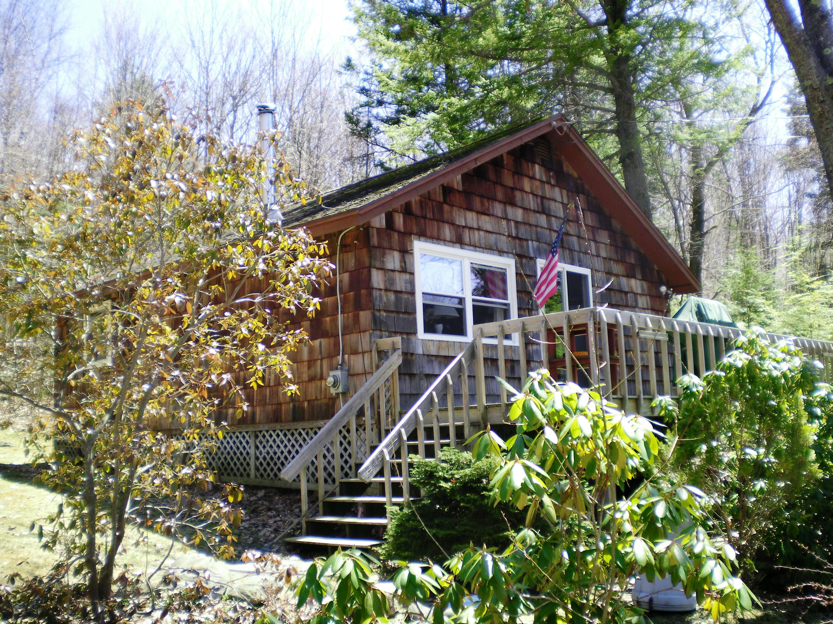 27 Lake View Road Peru, MA 01235 - Photo 3 of 26 a view of a house with a small yard and wooden fence