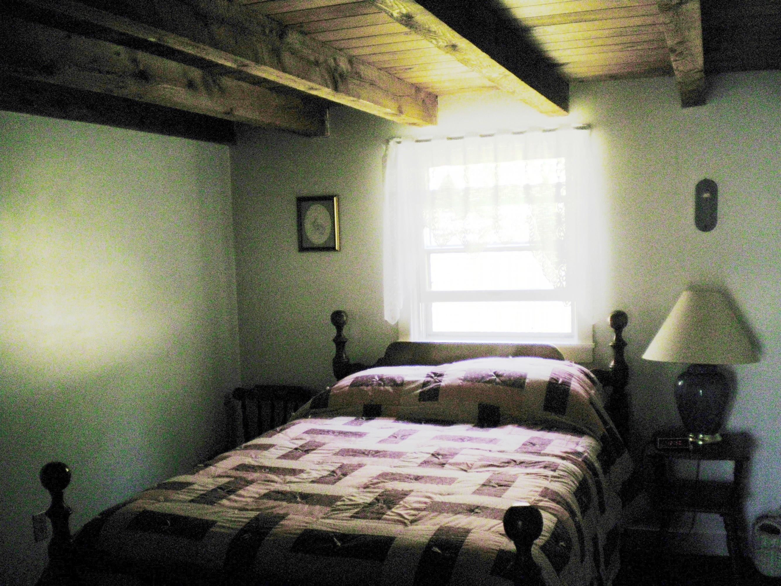 27 Lake View Road Peru, MA 01235 - Photo 22 of 26 a bedroom with a bed and window