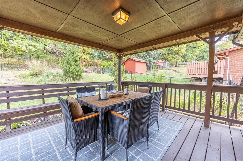 624 Fort Couch Road Pittsburgh, PA 15241 - Photo 32 of 32 a view of a porch with furniture and wooden floor