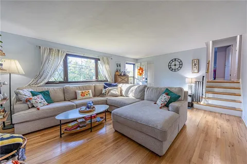 a living room with furniture and windows