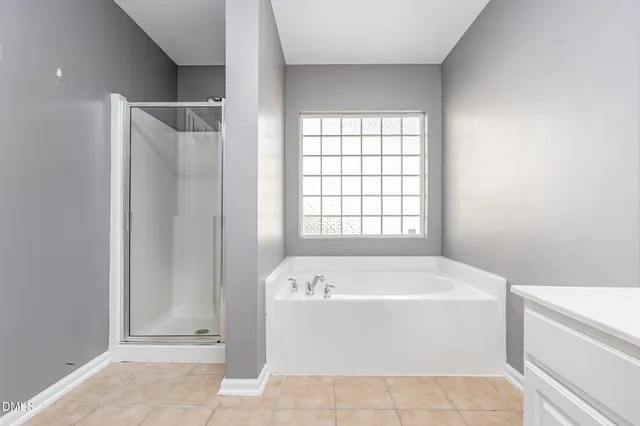 a white bath tub sitting next to a white sink