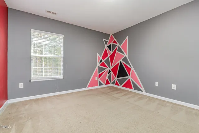 a room with white walls and windows