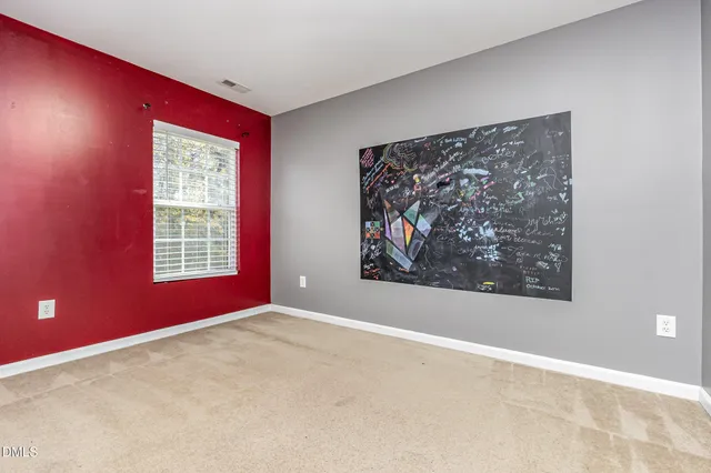 a view of a big room with windows