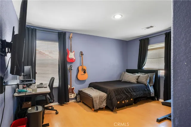 a bedroom with furniture and a window