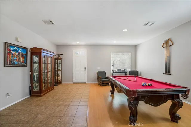 a bedroom with furniture and window