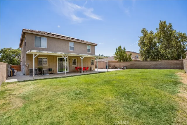 a view of a house with a yard porch and sitting area