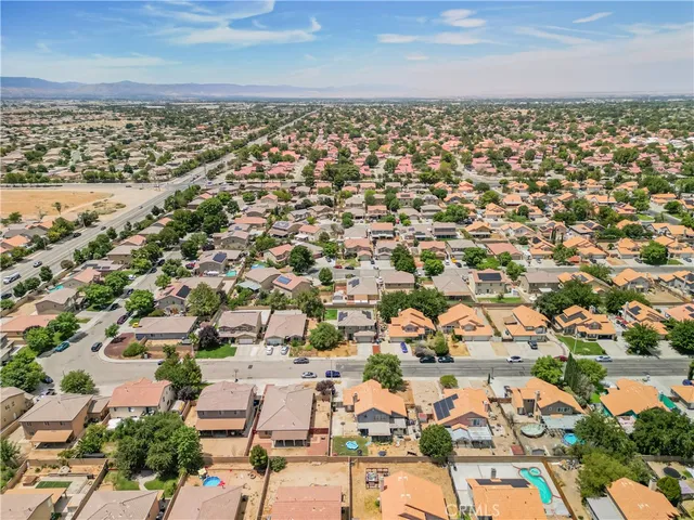 an aerial view of residential building with parking space