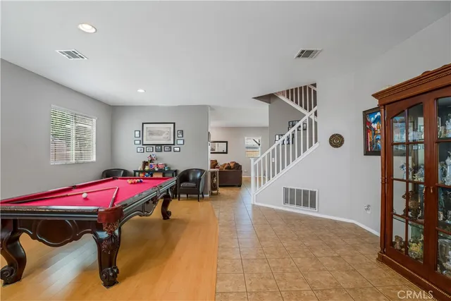 a living room with a bed and furniture