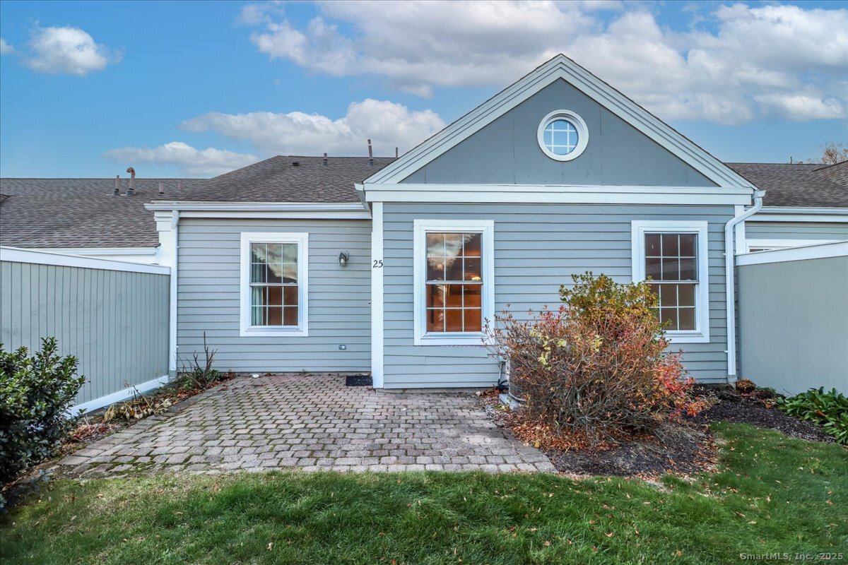 25 St George Place Newtown, CT 06482 - Photo 24 of 35 a front view of a house with garden
