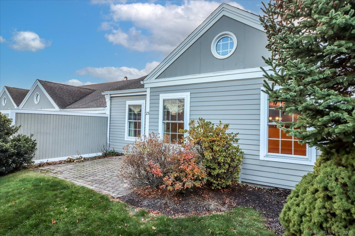 25 St George Place Newtown, CT 06482 - Photo 26 of 35 a view of a house with a yard and potted plants