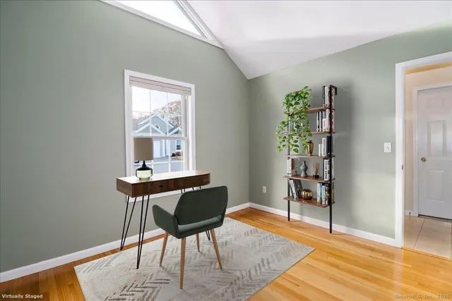 a workspace with furniture and window