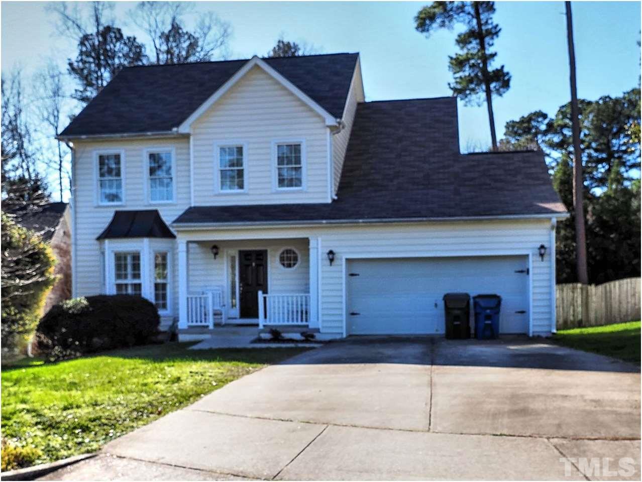 2312 Clerestory Place Raleigh, NC 27615 - Photo 1 of 25 a front view of a house with a yard and garage
