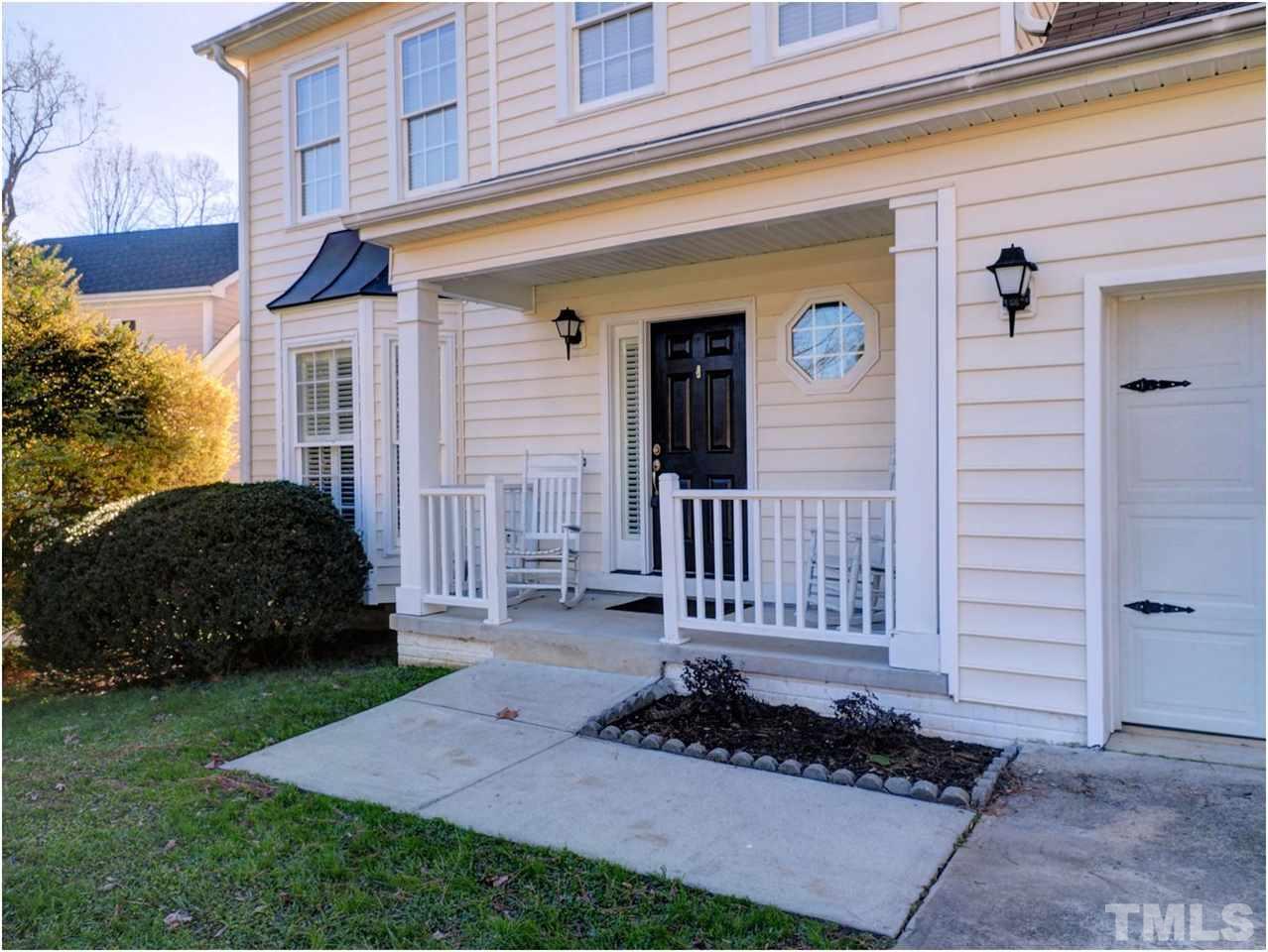 2312 Clerestory Place Raleigh, NC 27615 - Photo 2 of 25 a front view of a house with a garden