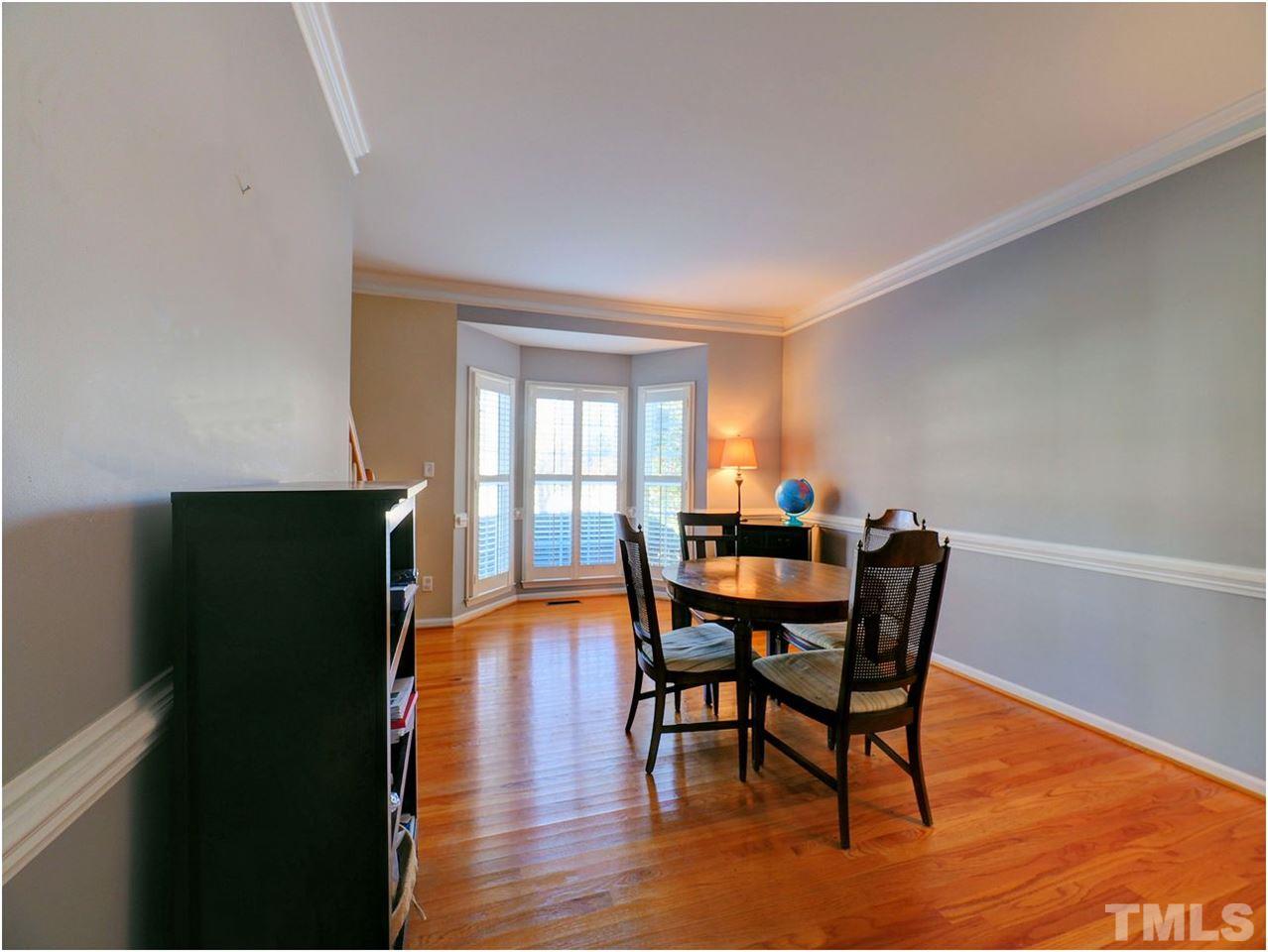2312 Clerestory Place Raleigh, NC 27615 - Photo 13 of 25 a view of a dining room with furniture and wooden floor