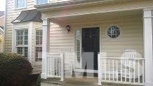 2312 Clerestory Place Raleigh, NC 27615 - Photo 3 of 25 a front view of a house with a glass door