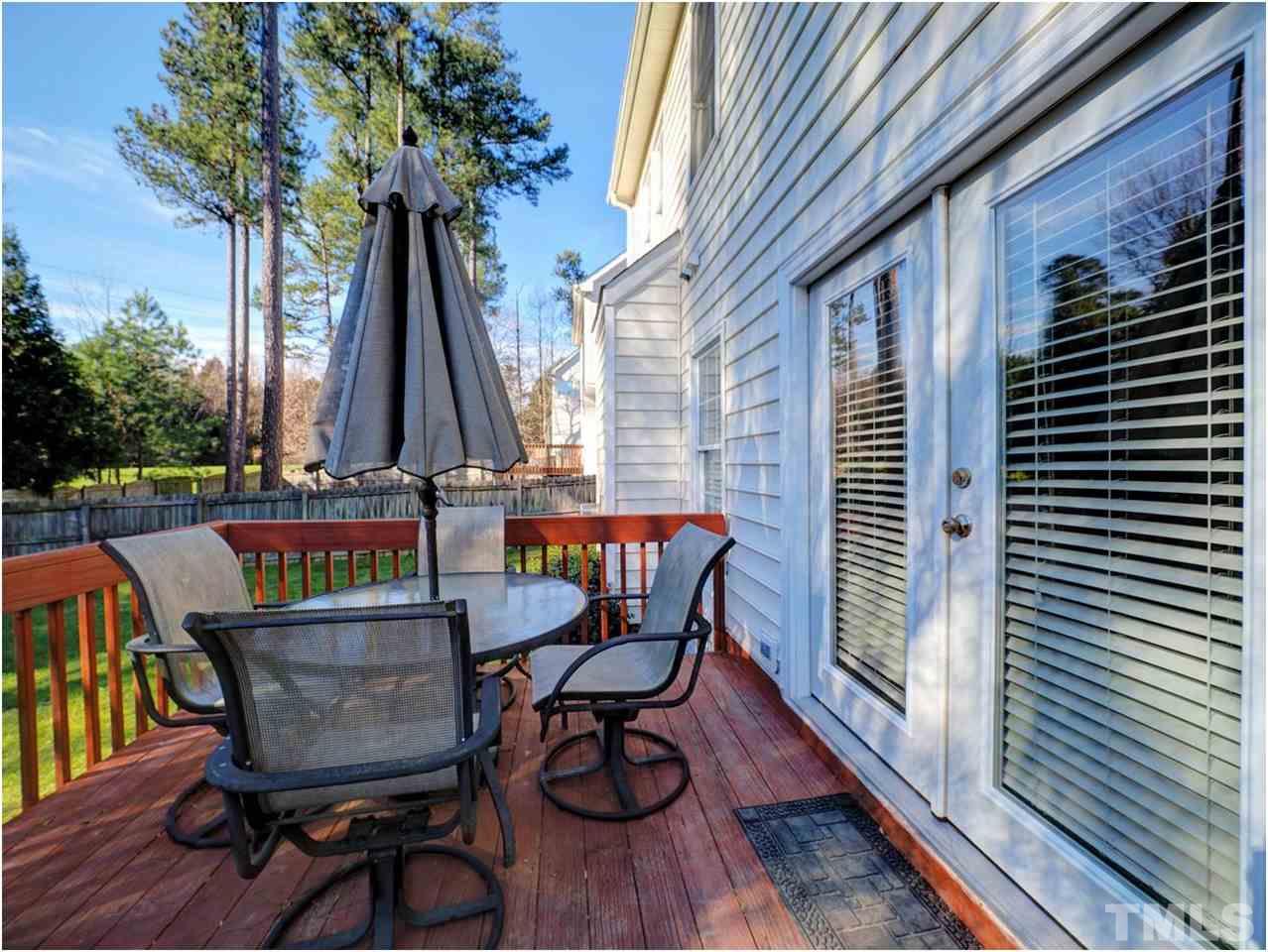 2312 Clerestory Place Raleigh, NC 27615 - Photo 22 of 25 a view of balcony with wooden floor and outdoor seating
