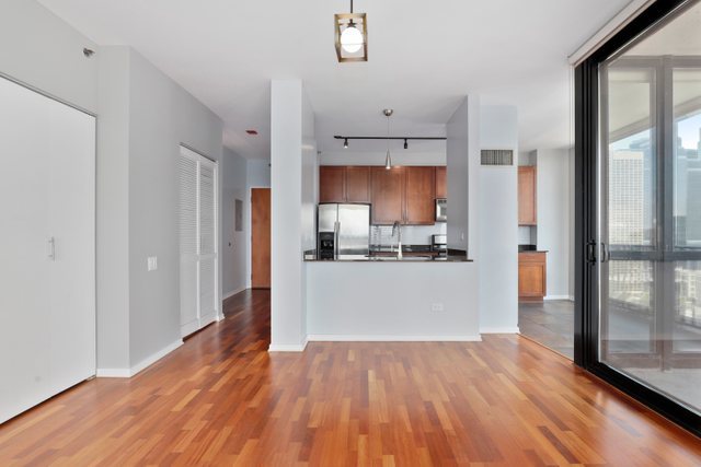 210 South Desplaines Street, Unit 2002 Chicago, IL 60661 - Photo 18 of 24 a view of a kitchen with wooden floor