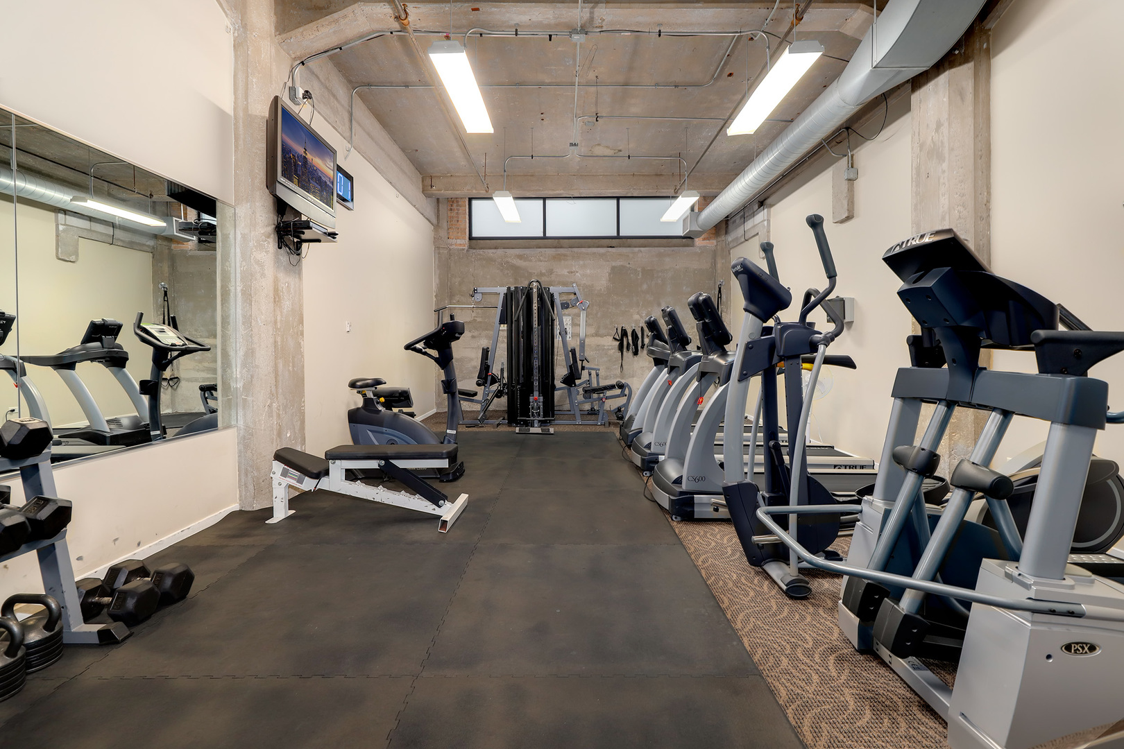 210 South Desplaines Street, Unit 2002 Chicago, IL 60661 - Photo 21 of 24 a view of a room with gym equipment