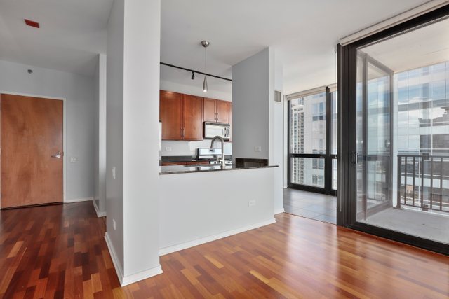 210 South Desplaines Street, Unit 2002 Chicago, IL 60661 - Photo 6 of 24 a view of kitchen with wooden floor