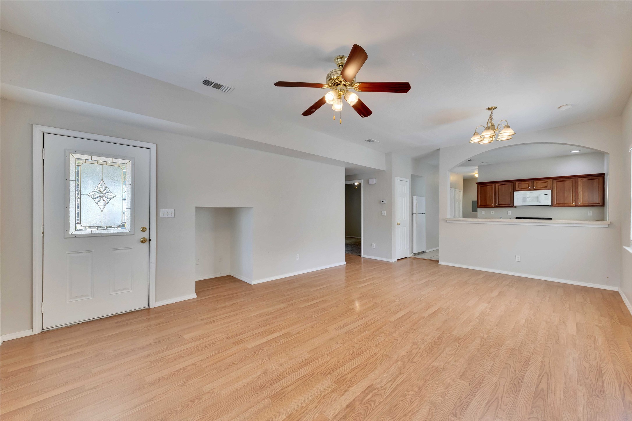 2201 East 18th Street, Unit B Austin, TX 78702 - Photo 1 of 25 A well-lit main living space offers a harmonious flow to the kitchen, perfect for effortless entertaining.