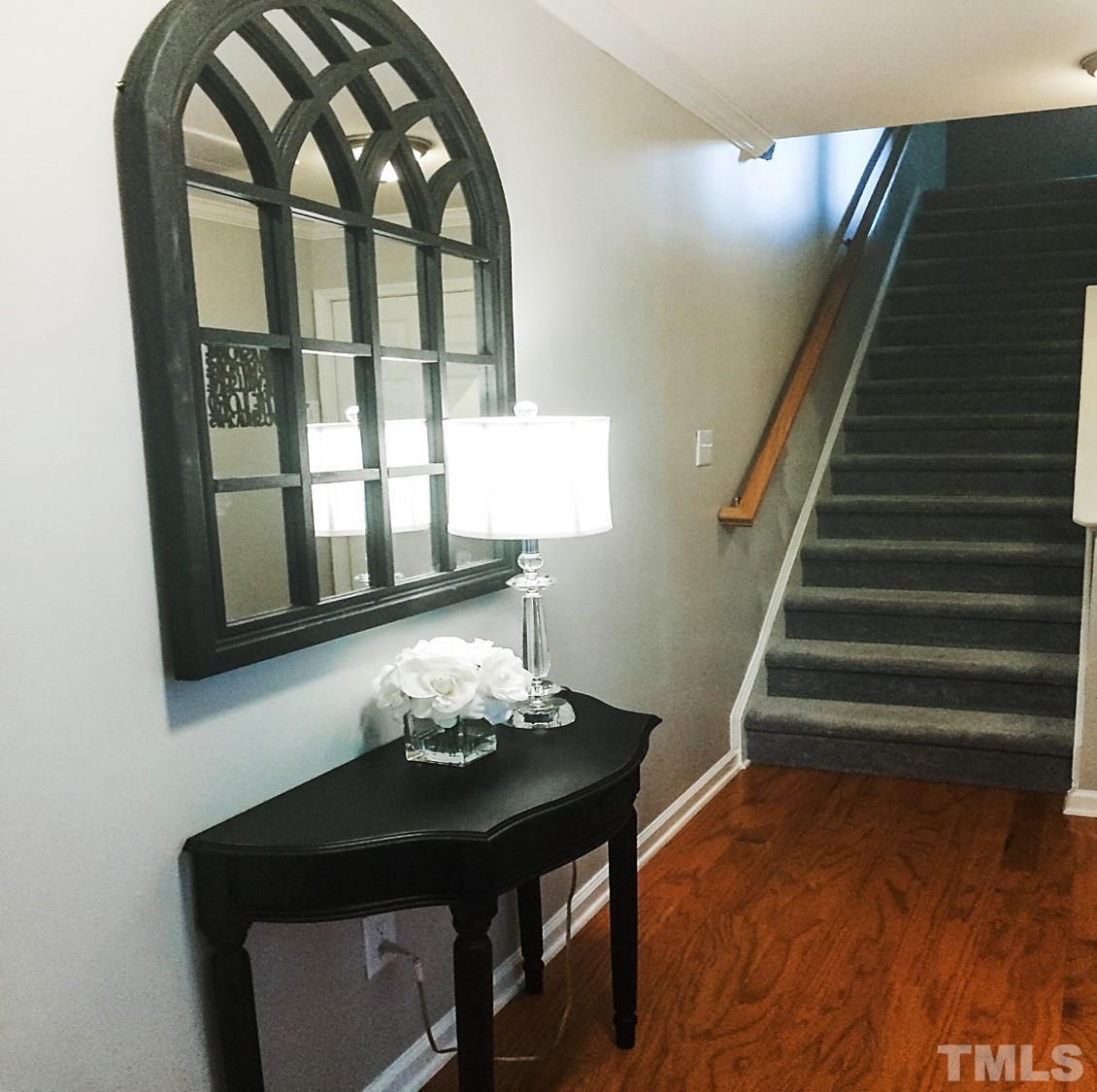 9906 Marni Court Raleigh, NC 27617 - Photo 3 of 11 a living room with furniture and a floor to ceiling window