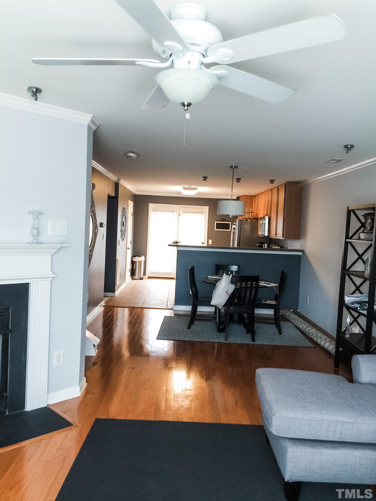 9906 Marni Court Raleigh, NC 27617 - Photo 8 of 11 a living room with furniture and a large window