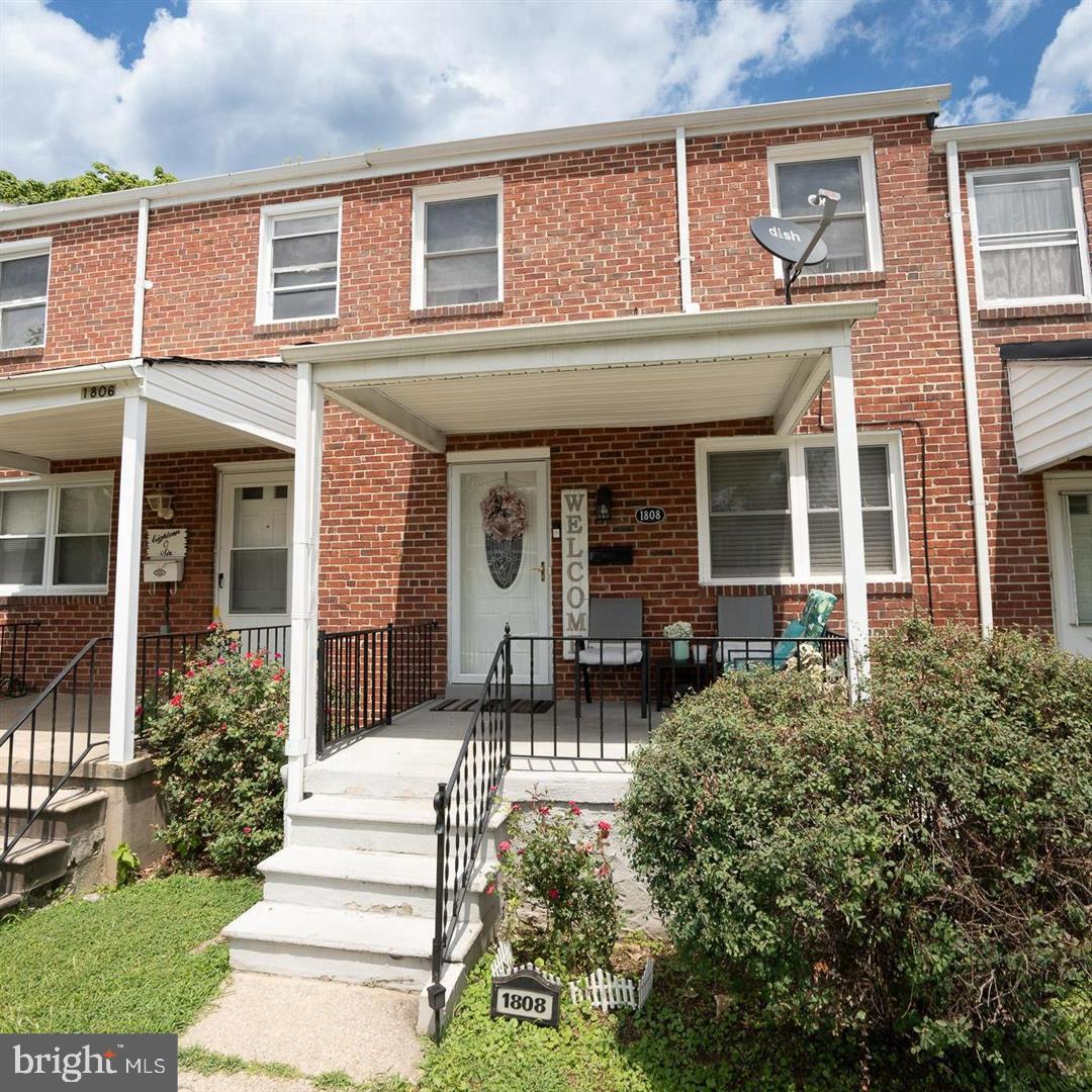 Charming brick townhouse with welcoming entry.