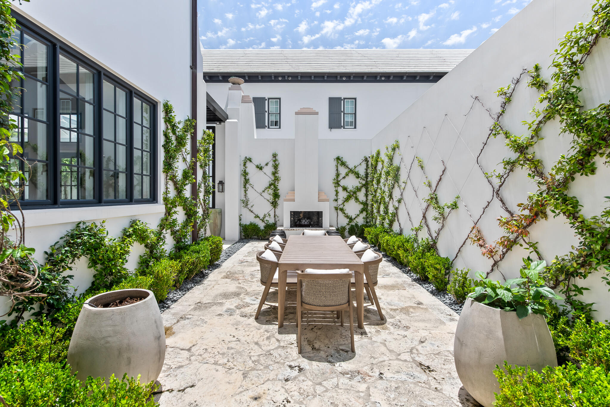 25 Moongate Court Inlet Beach, FL 32461 - Photo 16 of 53 a view of a patio with table and chairs and potted plants