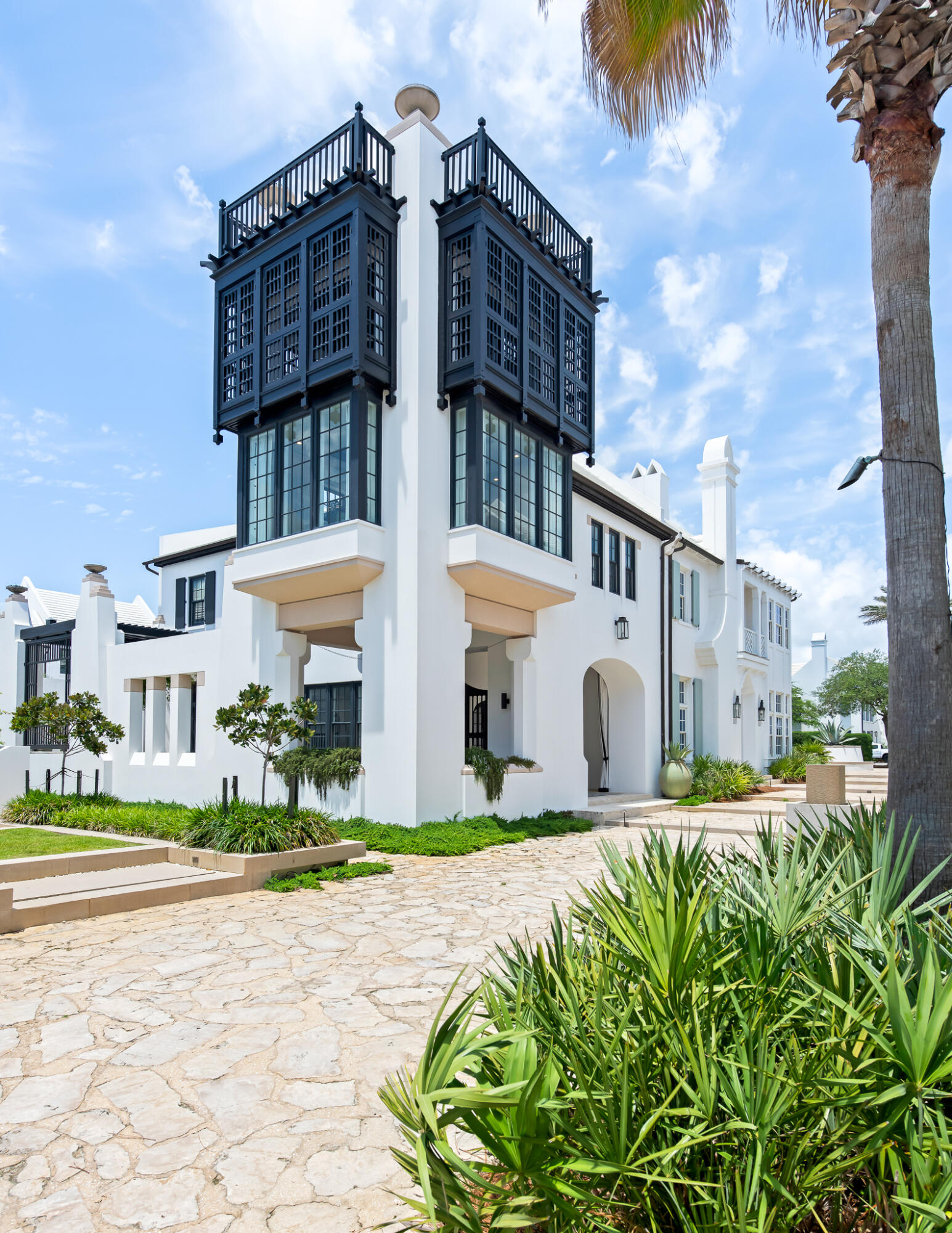 25 Moongate Court Inlet Beach, FL 32461 - Photo 2 of 53 a front view of a building with a garden