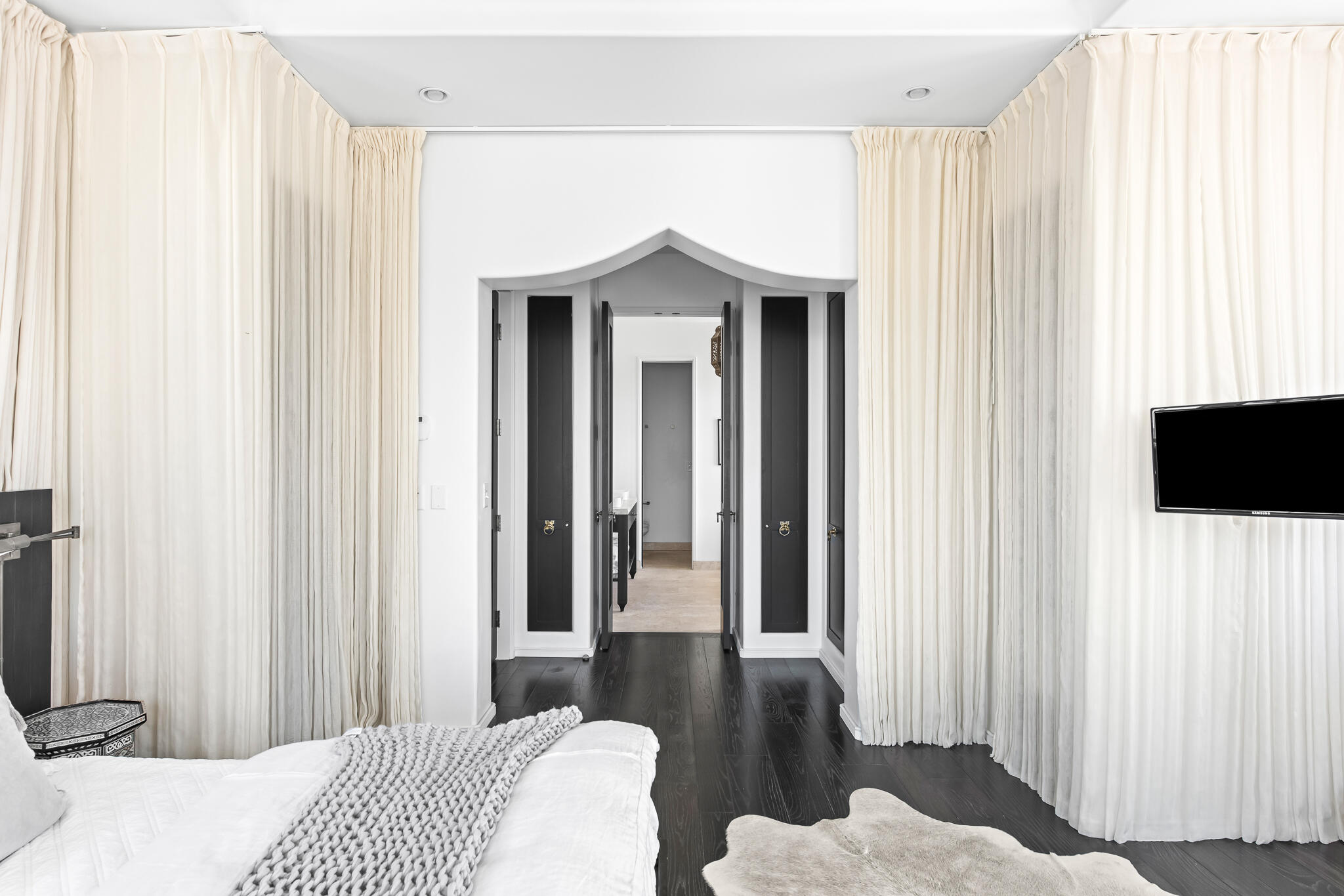 25 Moongate Court Inlet Beach, FL 32461 - Photo 29 of 53 a bedroom with a bed and a flat tv screen next to a window