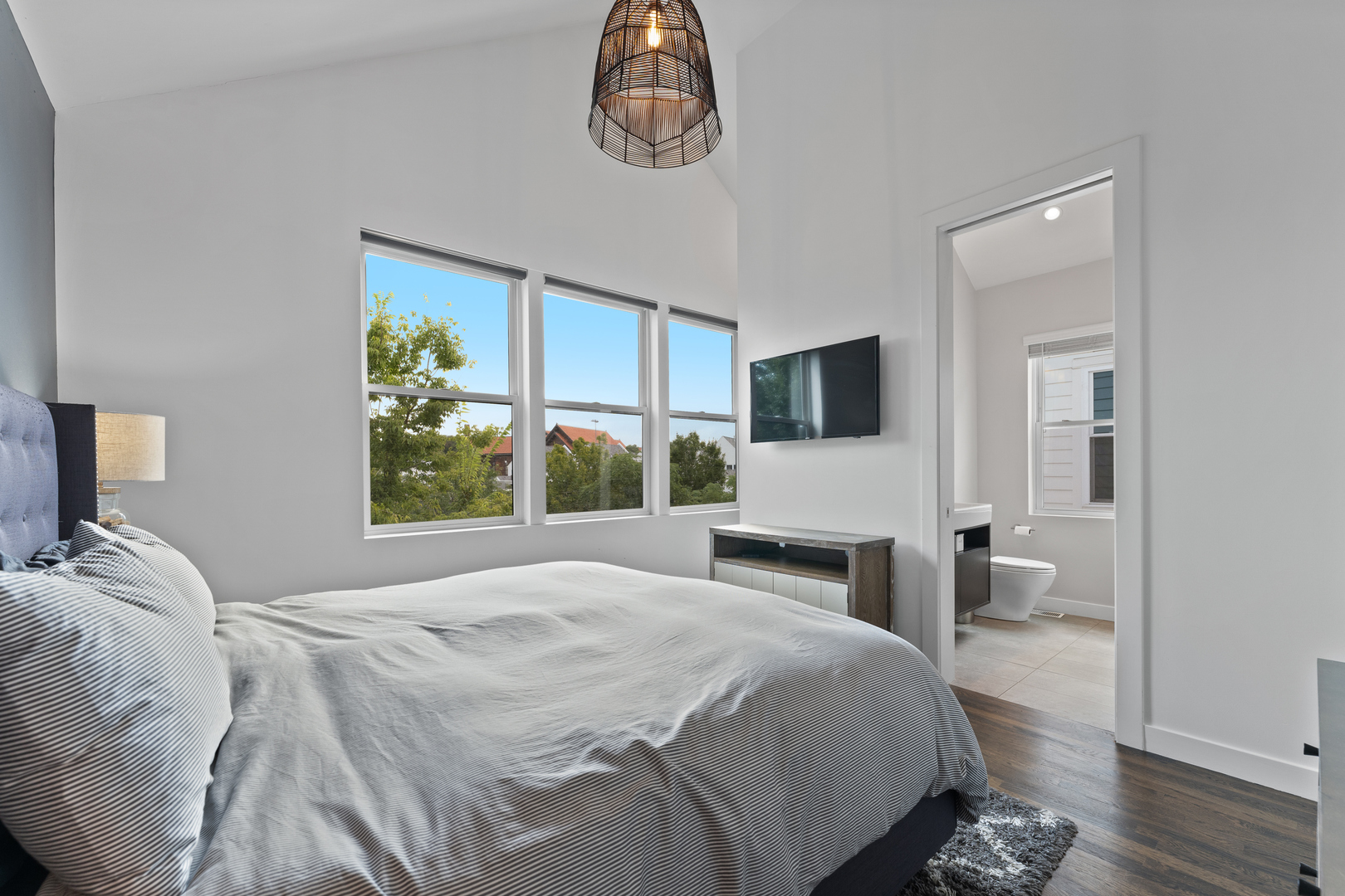 3650 North Kenneth Avenue Chicago, IL 60641 - Photo 16 of 39 a bedroom with a bed and a chandelier