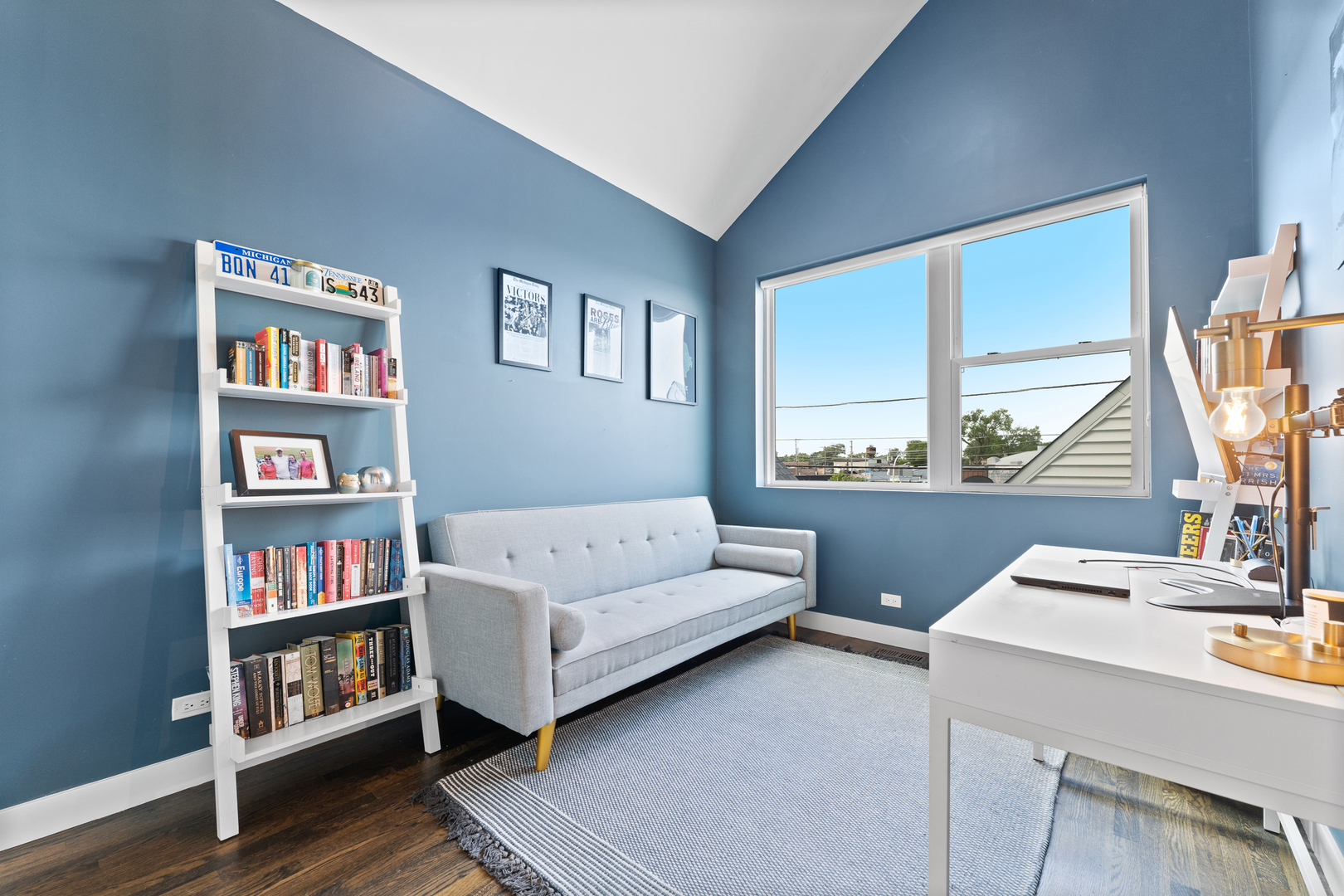 3650 North Kenneth Avenue Chicago, IL 60641 - Photo 22 of 39 a living room with couch and a book shelf