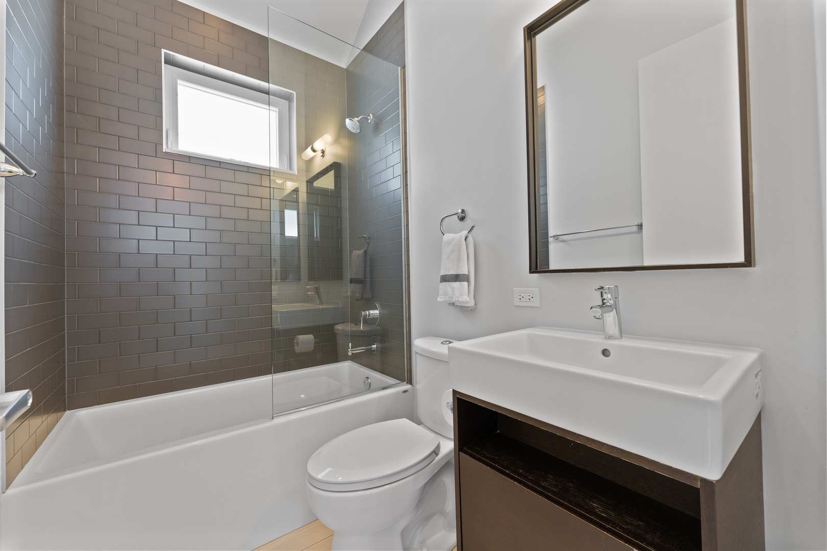 3650 North Kenneth Avenue Chicago, IL 60641 - Photo 24 of 39 a bathroom with a sink a toilet a bathtub and shower
