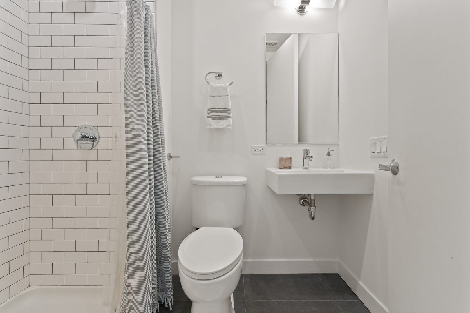 3650 North Kenneth Avenue Chicago, IL 60641 - Photo 30 of 39 a bathroom with a sink a toilet and a mirror