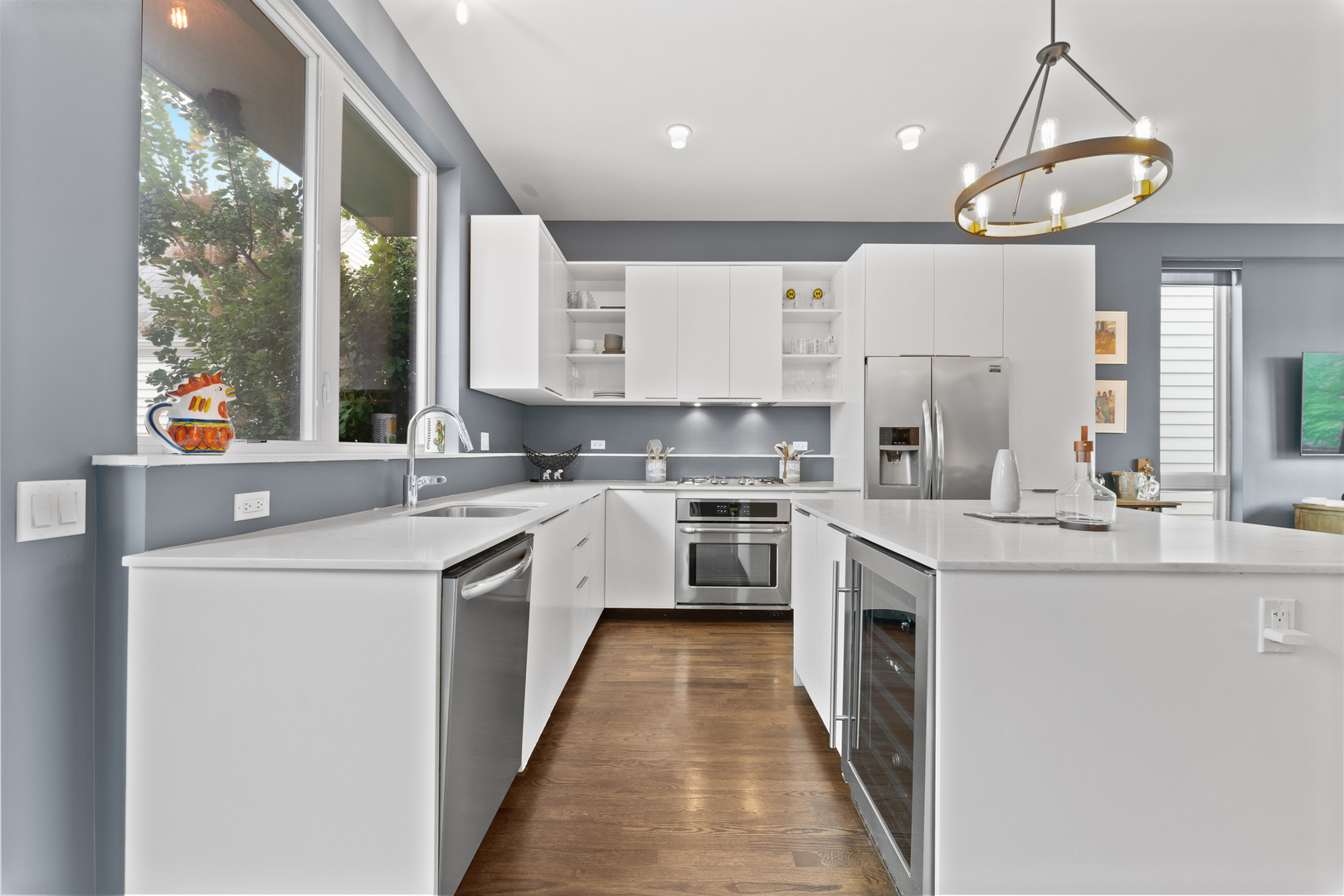 3650 North Kenneth Avenue Chicago, IL 60641 - Photo 10 of 39 a kitchen with a sink a counter top space stainless steel appliances and cabinets