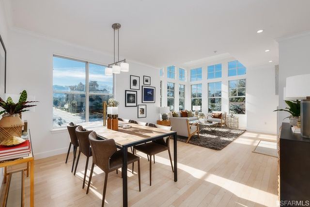 a view of a dining room with furniture and window