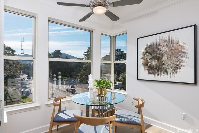 a bathroom with a granite countertop sink a large mirror and a shower