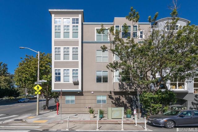 a front view of a building with street view