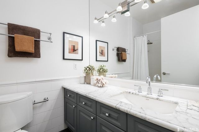 a view of a chairs and table in the balcony